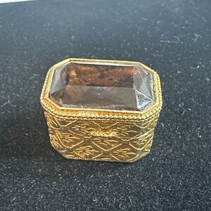 195- Florenza Vtge. trinket box with a large amber-colored faceted crystal top.